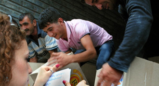 Action to collect aid for Syrian Armenians "Help your brothers!" Loading of humanitarian aid, Nagorno-Karabakh, Stepanakert, September 27, 2012. Photo by Knar Babayan