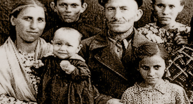 Dalkhat Lokmanovich Kholaev in exile with his family in the Jalalabad Rgion, Kyrgyz SSR. Photo frpm the fund of the Memorial Museum of Repressions and Genocide of Balkar People in 1944-57: http://www.gulagmuseum.org