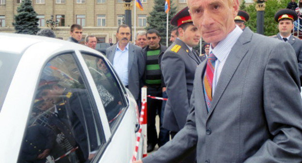 Karen Sarkisyan, a Karabakh War veteran, with a car, his gift on the occasion of triple holiday; Stepanakert, Nagorno-Karabakh, May 9, 2013. Photo by Alvard Grigoryan for the "Caucasian Knot"