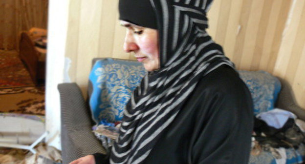 Zuleikha Karnaeva inspects her house after explosion; Buynaksk, Dagestan; May 8, 2013. Photo by the "Caucasian Knot"