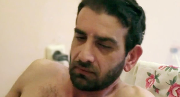 Mardiros Demerchyan tells the “Caucasian Knot” correspondent about being tortured in the police department of the settlement of Blinovo. Sochi, neuro-surgical unit of municipal hospital No 4, June 16, 2013. Shot from footage by Svetlana Kravchenko for the “Caucasian Knot”