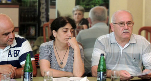 Participants of the project "Strengthening of Women's Capacity for Building Peace in Southern Caucasus" completed by the human rights organization "Centre of Civil Initiatives" in Nagorno-Karabakh. From left to right: the head of the Stepanakert rehabilitation center Vardan Tadevosyan; the chief of the target group in Shushi Anait Tovmasyan;
the head of the "Centre of Civil Initiatives" Albert Voskanyan. Nagorno-Karabakh, Stepanakert, June 29, 2013. Photo by Marta Altunyan, http://www.kavkaz-uzel.ru/blogs/929/posts/15113