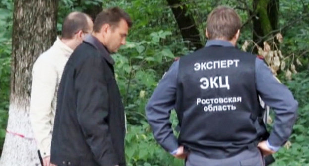 Investigating group at the spot of the skirmish with a gang that committed attacks on policemen. The city of Aksai, Rostov Region, September 8, 2013. Snapshot of a footage by the press-cutting service of the Russian Ministry of Internal Affairs (MIA) for the Rostov Region