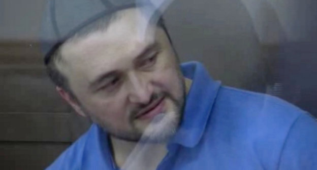 Rustam Makhmudov at the court session at the Moscow City Court on the case of the murder of journalist Anna Politkovskaya, June 4, 2013. Photo shot from video record of the court trial, http://mosgorsud.ru/