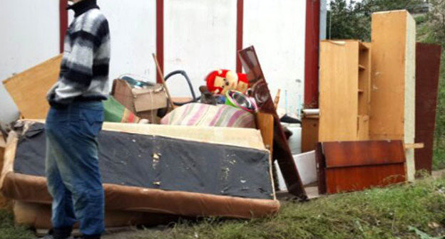 Belongings of the residents of the TAC "Promzhilbaza" moved out to the street by the city authorities. Ingushetia, Karabulak, October 7, 2013. Photo courtesy of the local inhabitants