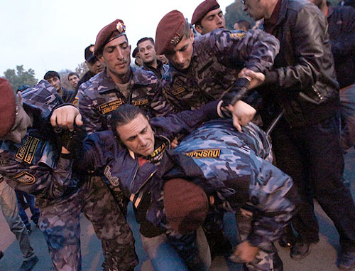 Police detains the participants of the protest action "Million Mask March". Yerevan, November 5, 2013. Photo: © PanARMENIAN Photo/Hrant Khachatryan