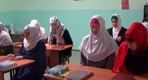 Students of Islamic courses organised by the religious group "As-Salam" at the lectures in madrasa. Stavropol, November 2013. Screenshot of a video report of Islamic information portal Islam.ru