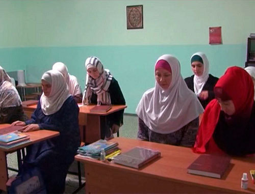 Students of Islamic courses organised by the religious group "As-Salam" at the lectures in madrasa. Stavropol, November 2013. Screenshot of a video report of Islamic information portal Islam.ru