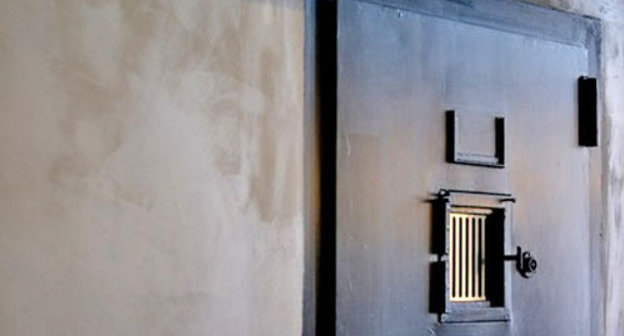 Door to a prison cell. Photo by user arnedielis, Flickr.com