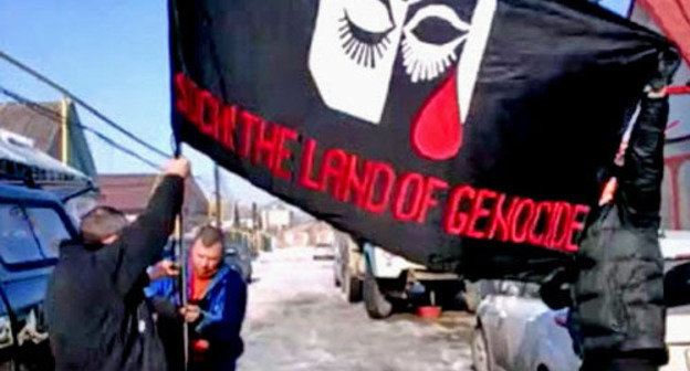 Flag of the rally against Sochi Olympics, Nalchik, February 7, 2014. Screenshot from video http://bambuser.com/