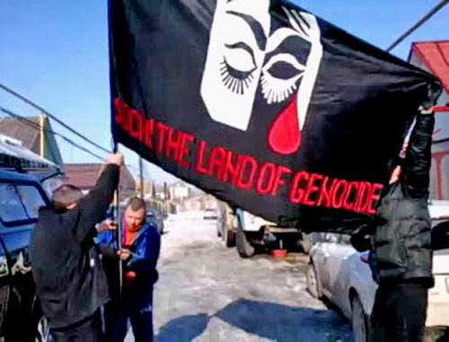 Flag of the rally against Sochi Olympics, Nalchik, February 7, 2014. Screenshot from video http://bambuser.com/