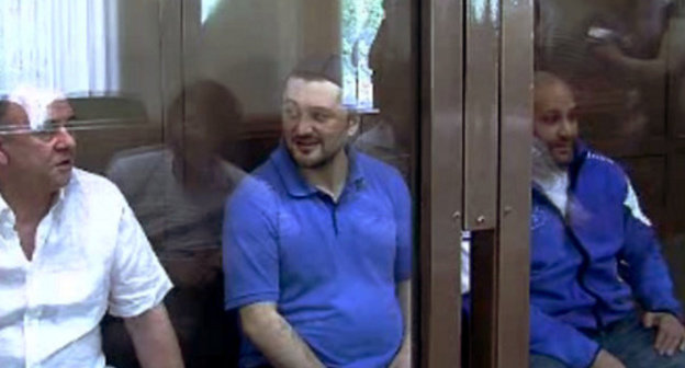 Defendants in the case of the murder of Anna Politkovskaya - Lom-Ali Gaitukaev, Rustam Makhmudov and Sergey Khadjikurbanov at the Moscow Court, June 4, 2013. Screenshot from video records of the Moscow Court press-service. 