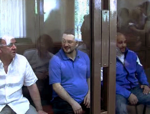 Defendants in the case of the murder of Anna Politkovskaya - Lom-Ali Gaitukaev, Rustam Makhmudov and Sergey Khadjikurbanov at the Moscow Court, June 4, 2013. Screenshot from video records of the Moscow Court press-service. 