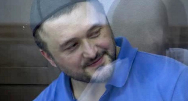 Rustam Makhmudov accused of the murder of Anna Politkovskaya, in the courtroom. June 4, 2013. Screenshot of a video by the press service of the Moscow City Court, http://www.mos-gorsud.ru/video/sudzs/?pn=0&id=168