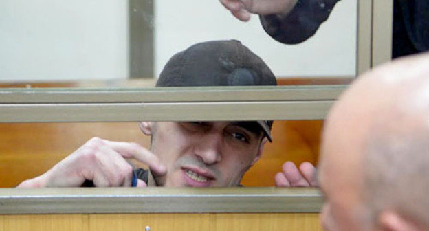 Convicted Yusup Dzangiev talks to his father in the courtroom in the North-Caucasian District Military Court. Rostov-on-Don, April 8, 2014. Photo by Oleg Pchelov for the "Caucasian Knot"