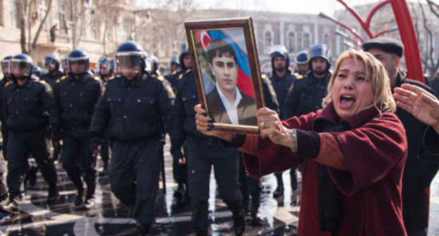 Azerbaijani woman holding portrait of the perished soldier during the rally against non-combat losses in the Army. Baku, March 10, 2013. Photo by Aziz Karimov for the ‘Caucasian Knot’. 