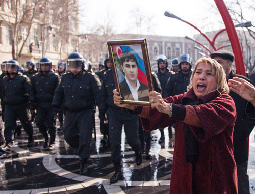 Azerbaijani woman holding portrait of the perished soldier during the rally against non-combat losses in the Army. Baku, March 10, 2013. Photo by Aziz Karimov for the ‘Caucasian Knot’. 