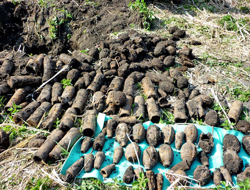 A hideout with grenades and shells of the Russian Civil War found by the local ethnographic expedition "Native Landscape", headed by Victor Kotlyarov and Maria Kotlyarova. Kabardino-Balkaria, April 22, 2014. Photo by Lyudmila Maratova