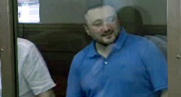 Rustam Makhmudov, accused of committing the murder of Anna Politkovskaya, at the court session on June 6, 2013. Screenshot of a video by the press service of the Moscow City Court, http://www.mos-gorsud.ru/