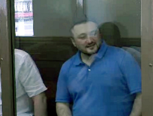 Rustam Makhmudov, accused of committing the murder of Anna Politkovskaya, at the court session on June 6, 2013. Screenshot of a video by the press service of the Moscow City Court, http://www.mos-gorsud.ru/