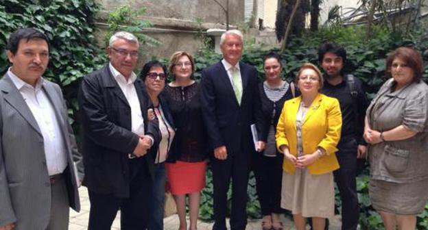 To the right: civil society activists Eldar Zeinalov, Eldar Namazov, Novella Dzhafaroglu, Saida Godzhamanly, Arzu Abdullaeva, Leyla Yunus, Emil Guseinov, Sadaat Bananyarly and Thorbjorn Jagland, the Secretary General of the Council of Europe (CoE) (in the centre) in the yard of the Baku office of the CoE. May 20, 2014. Photo by IRFS