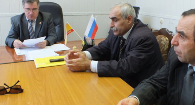 Members of the organizing committee of the "Extraordinary Congress of Dagestani Nations" Ruslan Rasulov, Gadzhi Mirzaev and Nurmagomed Gazimagomedov in the office of the Dagestani branch of the party "A Just Russia" after an attempt of holding a meeting has been disrupted. Makhachkala, April 19, 2014. Photo by Patimat Makhmudova for the "Caucasian Knot"