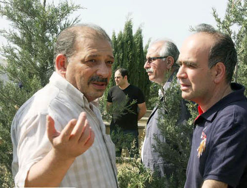 Rauf Mirkadirov (to the left) at the funeral of his father. Baku, May 24, 2014. Photo IA "Turan"
