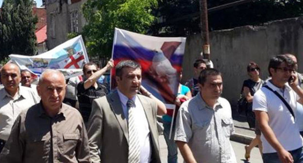 Demonstration in support of  restoration of the diplomatic relations with Russia, organised by the NPO coalition "Eurasian Choice-Georgia". Archil Chkoidze, the leader of the coalition, is second from the left. Tbilisi, May 28, 2014. Photo by Maya Khingachashvili, https://www.facebook.com/achiko.chkoidze/photos