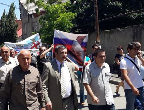 Demonstration in support of  restoration of the diplomatic relations with Russia, organised by the NPO coalition "Eurasian Choice-Georgia". Archil Chkoidze, the leader of the coalition, is second from the left. Tbilisi, May 28, 2014. Photo by Maya Khingachashvili, https://www.facebook.com/achiko.chkoidze/photos