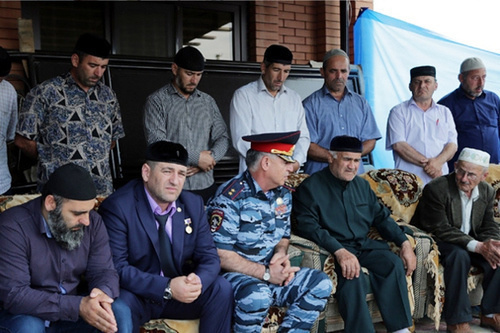 Chechnya MIA head Ruslan Alkhanov (in the centre) gives his condolences to the relatives of policeman Akhmed Dopaev killed in Grozny on June 22, 2014. Photo by Chechnya MIA head, http://95.mvd.ru/news/item/2315395