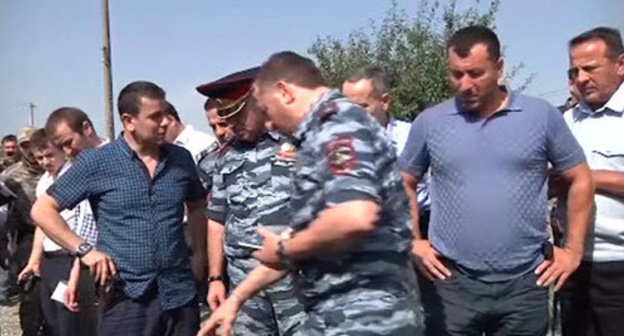 Law enforcers at the place where suspect in police officer’s murder was shot. Grozny, July 3, 2014. Screenshot from the video taken by press-service of Chechen MIA.