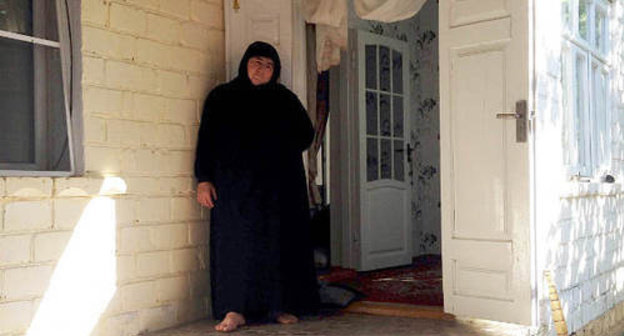 The village of Maidanskoe, Untsukul District of Dagestan, July 2014. Ayna Gamzatova, mother of the villager Magomed Payzulaev killed during the special operation on July 6, 2014, in the door of her house. Photo by Makhach Akhmedov for the "Caucasian Knot"