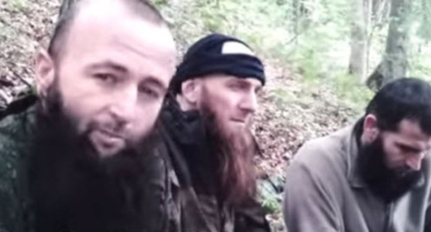 Screenshot from a video record of the burial of Doku Umarov, photo by YouTube user Albert Albertiny.