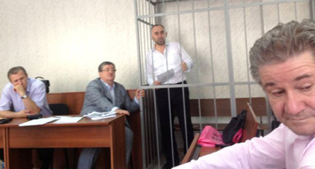 Kurman-Ali Baichorov (in the centre) in the court room. Photo: ANSAR, http://www.ansar.ru/sobcor/2014/08/26/52798" class="main_article_image" src="http://www.kavkaz-uzel.ru/system/uploads/article_image/image/0007/75881/view_new.jpg