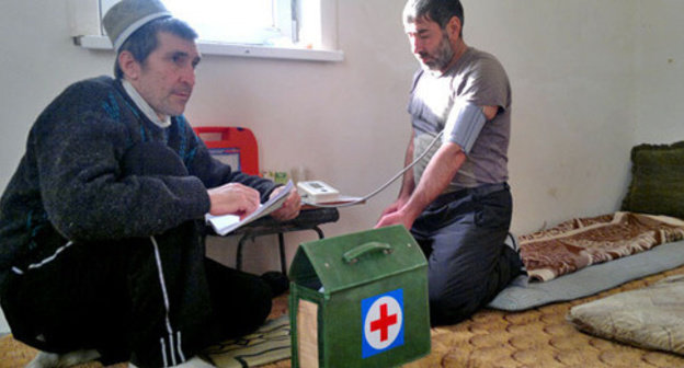 A doctor is measuring blood pressure of a hunger-striker. Karaman, November 2014. Photo by Rasul Magomedov for the "Caucasian Knot"