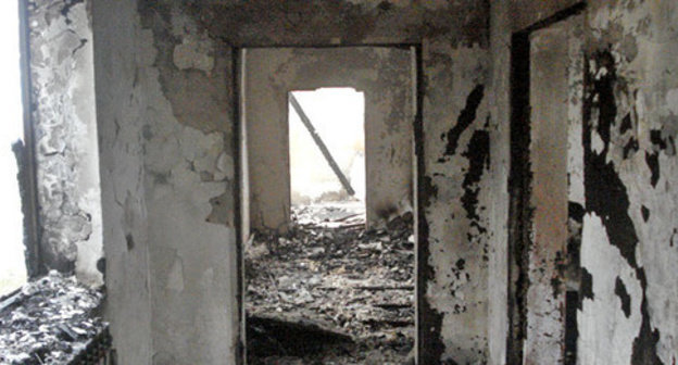 House burned down by law enforcers in the village of Yandi, Achkhoi-Martan District, December 7 2014. Photo provided by the HRC "Memorial" press-service. 