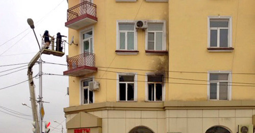 The building where the office of the Joint Mobile Group of the Committee against Torture (CaT) is located, after the fire. Grozny, December 154, 2014. Photo by Akhmed Aldebirov for the "Caucasian Knot"