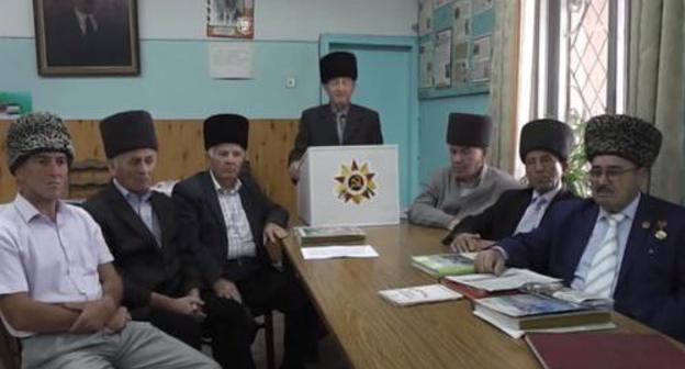 Baksan elders. Screenshot of video at: https://www.youtube.com/watch?v=4GKaLaWvHqI