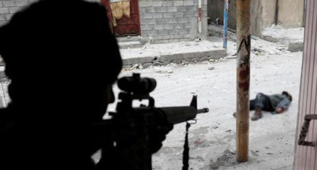 A shooter. Iraq. Photo: REUTERS/Goran Tomasevic