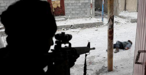 A shooter. Iraq. Photo: REUTERS/Goran Tomasevic