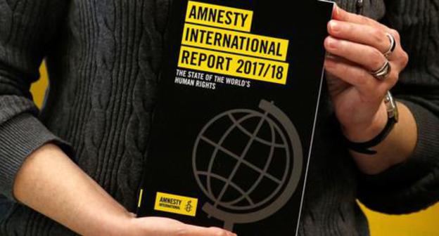 The report of the Amnesty International. Photo: REUTERS/Bobby Yip