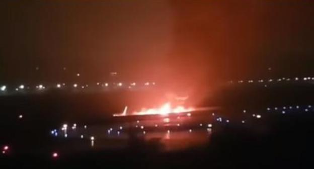 Burning plane in Sochi airport. Screenshot from video: https://youtu.be/W94S9Zo40RQ