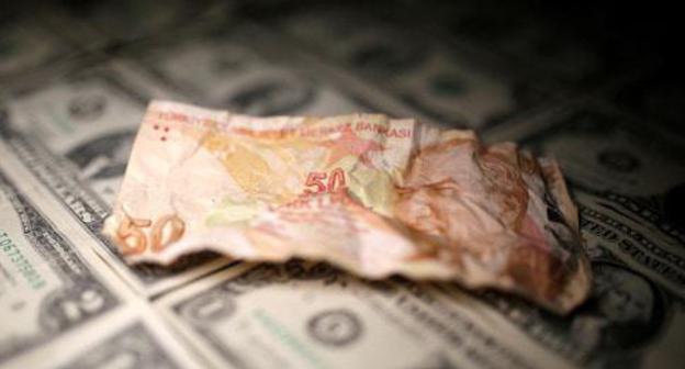 The Turkish lira and the dollars. Photo: REUTERS/Dado Ruvic/Illustration