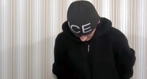 A detainee suspected of stealing a mobile phone. Screenshot of the video by the "Grozny" TV Channel https://www.youtube.com/watch?time_continue=11&amp;v=LCYrSwqngM8&amp;feature=emb_logo