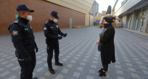 Policemen checking IDs, Baku, April 2020. Photo: REUTERS/Aziz Karimov