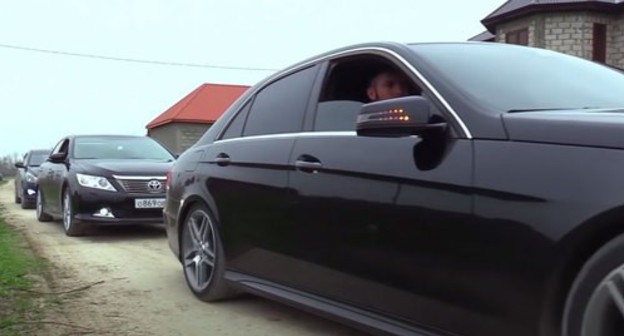 A wedding party cortege. Screenshot of the video at the "Чеченские свадьбы" студия Шархан YouTube channel https://www.youtube.com/watch?time_continue=203&amp;v=gt-OQMRN2Mo&amp;feature=emb_logo