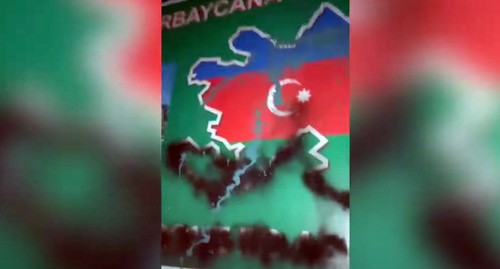 A banner with a map of Azerbaijan placed on the road from Goris to Kapan. Screenshot of the video by NEWS AM https://www.youtube.com/watch?v=m_P0RdLBAvQ&amp;feature=emb_logo