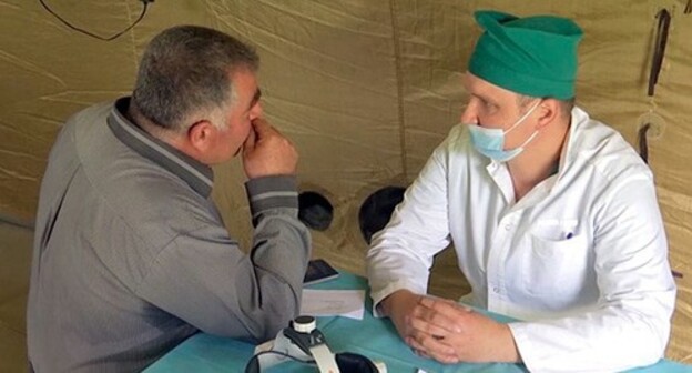 Military doctor and local resident in the village of Aknaberd of the Shaumyan District of Nagorno-Karabakh. Photo courtesy of the press service of the Russian Ministry of Defence