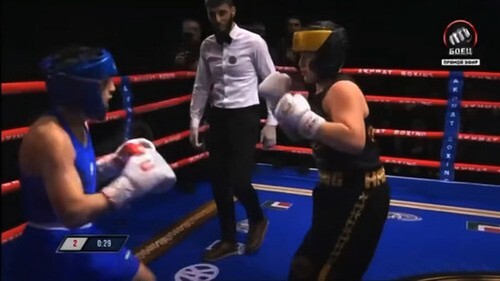 Boxing match of Aslan Bittirov (dressed in blue) and Adam Kadyrov (dressed in black). Screenshot: http://youtu.be/GrFMEoDgbrE