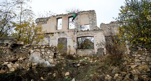 The Azerbaijani flag at the destroyed building in Fizuli after Azerbaijan took control over the territory. Photo by Aziz Karimov for the "Caucasian Knot"